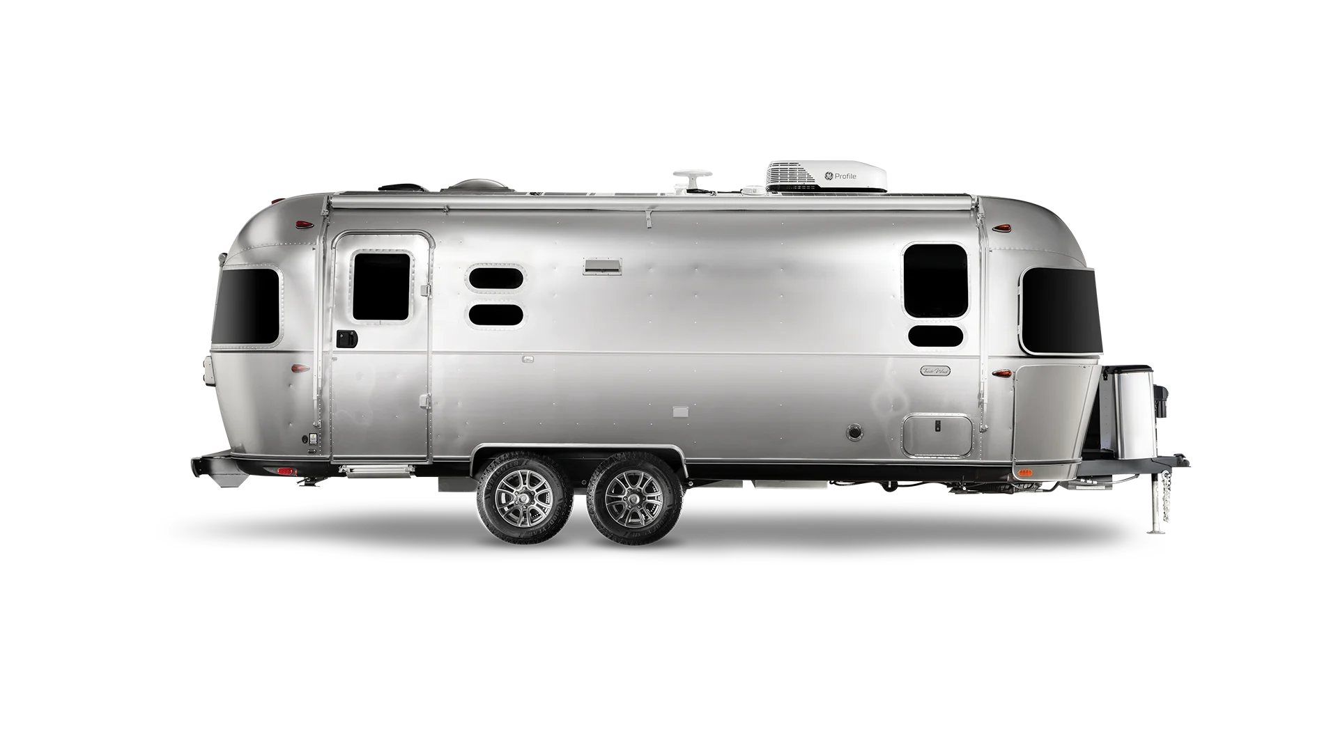 Sleek silver travel trailer with multiple windows and a streamlined design, set against a plain white background.