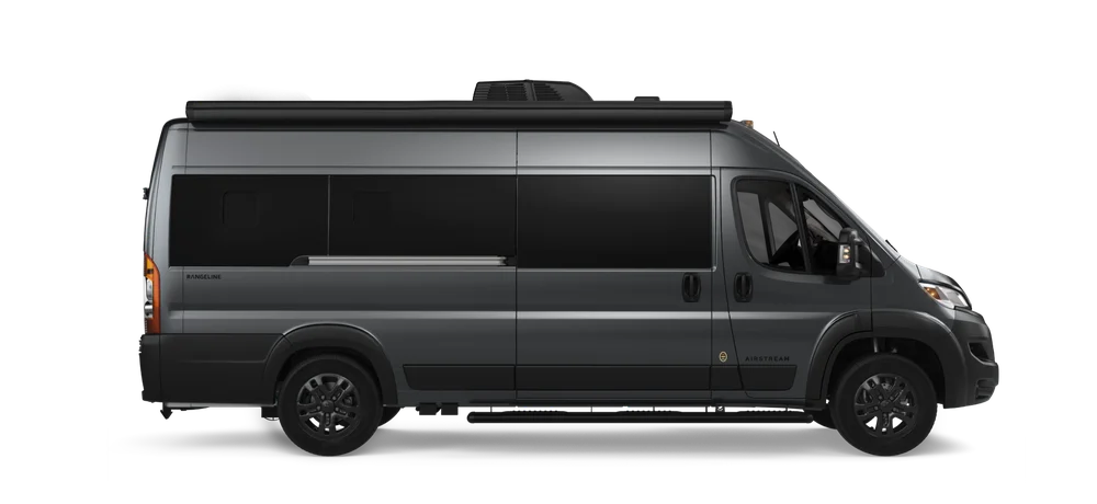 Side view of a sleek, dark gray Airstream Rangeline camper van with tinted windows and modern design.