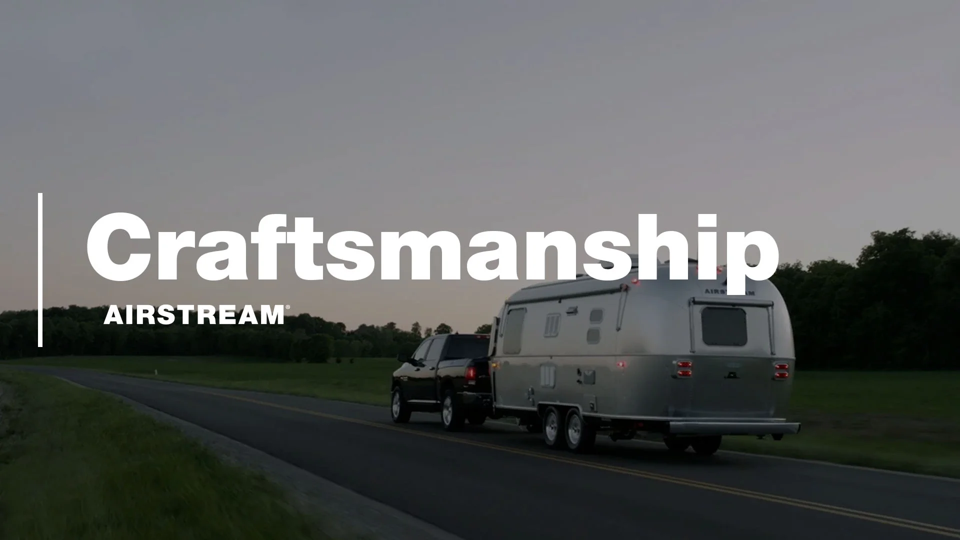 A truck pulls an Airstream trailer on a country road at dusk, with the words "Craftsmanship AIRSTREAM" overlaid.
