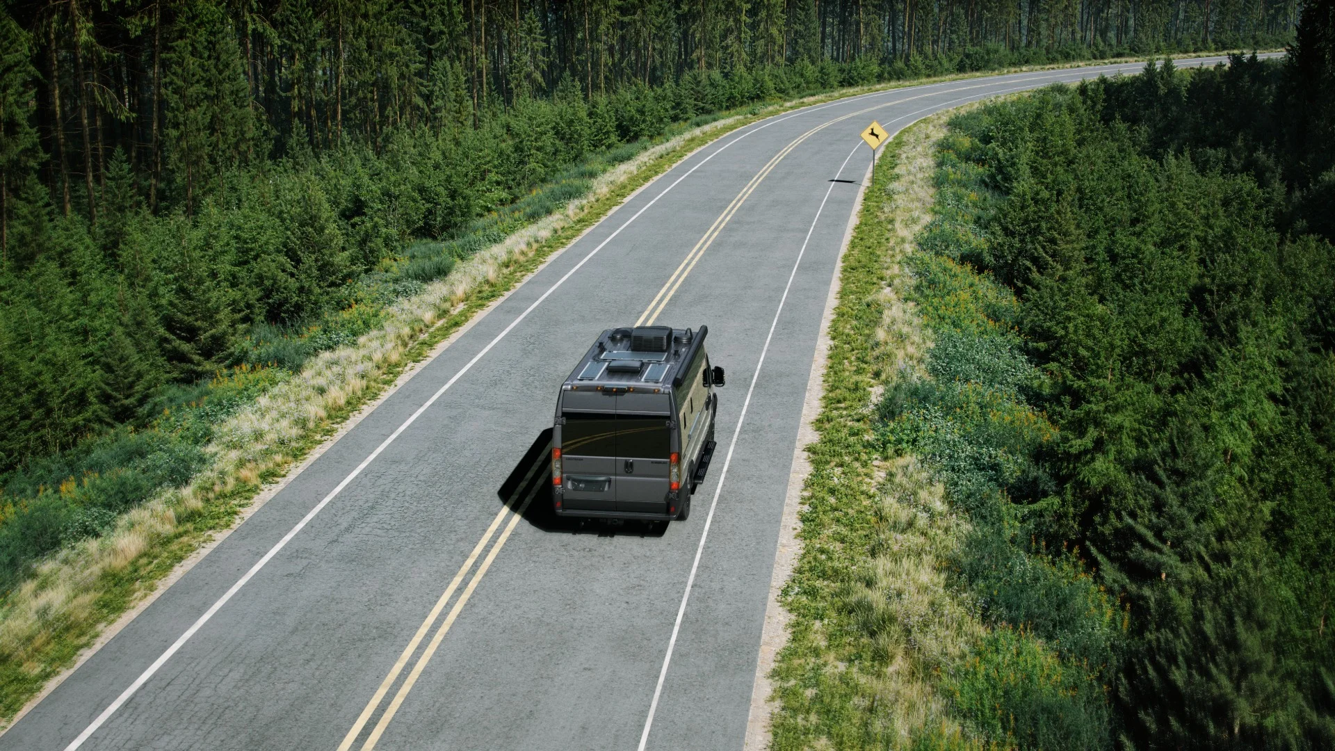 Camper van driving on a winding road through a dense forest, with a deer crossing sign ahead.