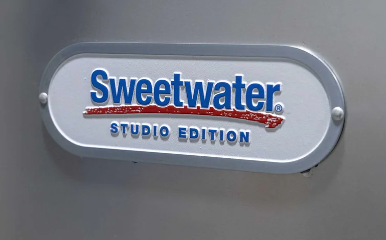 "Sweetwater Studio Edition" logo in blue and red on a white, oval-shaped plaque against a gray background.