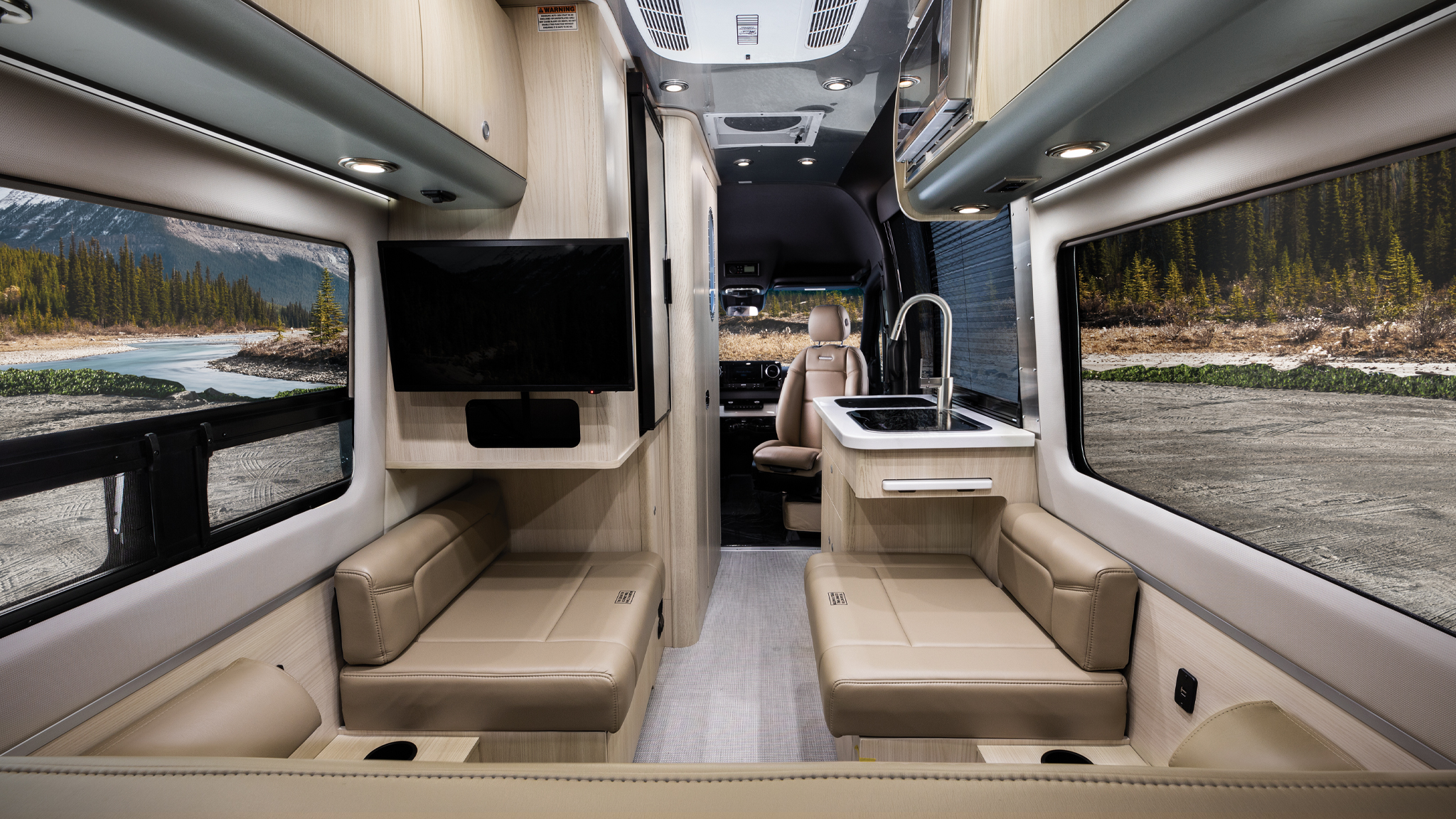 Airstream-Interstate-19-Features-Feature-Image|AIRMKT 2021 Interstate 19 Interior Formal Black_55258 Galley WEB|AIRMKT 2021 Interstate 19 Interior Formal Black_55365 Dash WEB|AIRMKT 2021 Interstate 19 Interior B2F Formal Black_55117 WEB|AIRMKT 2021 Interstate 19 Exterior Silver 3 Qtr WEB|The bathroom in the Interstate 19 Airstream touring coach.|Airstream Interstate 19 bed down in the touring coach.|Airstream-Interstate-19-Preview-Feature-Image
