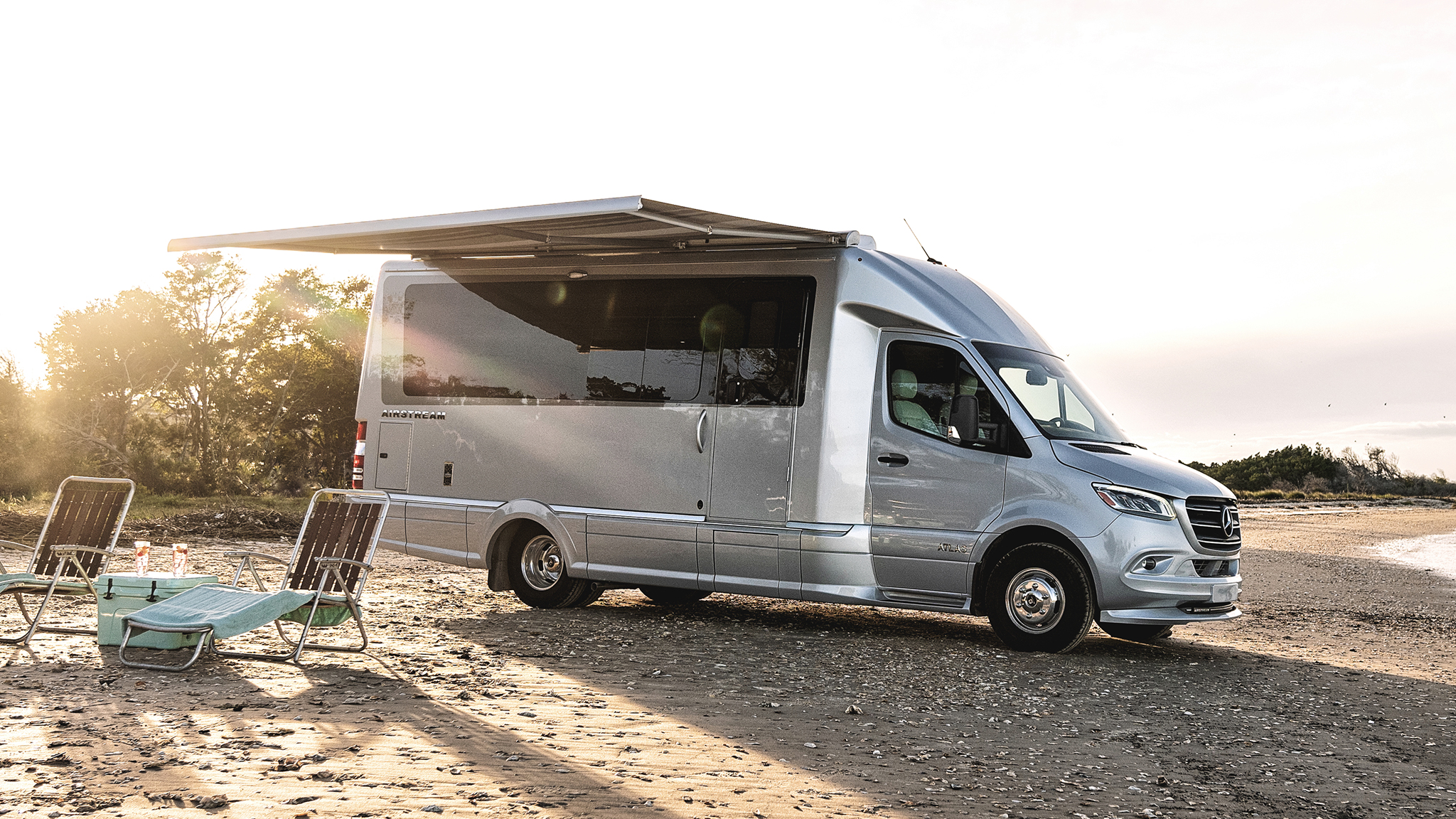 Touring Coach sitting on the beach|Airstream Atlas sitting on the beach|Airstream Atlas sitting on the beach