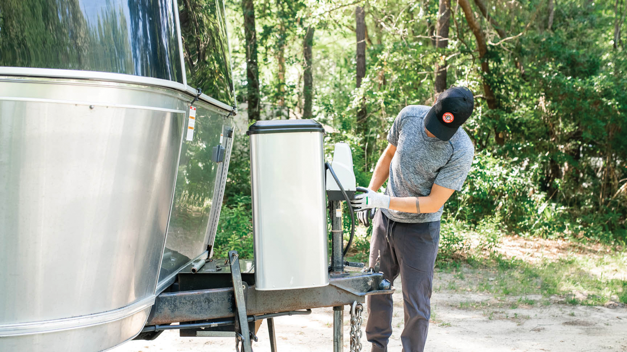 Propane-Tank-Feature-Image|Airstream-Weber-Grill-Nest-Promo-CTA|Checking propane tanks in an Airstream Travel Trailer|Filling the propane tanks in an Airstream Touring Coach|Propane-Tank-Preview-Image|Refrigerator in the 2022 Classic Airstream Travel Trailer
