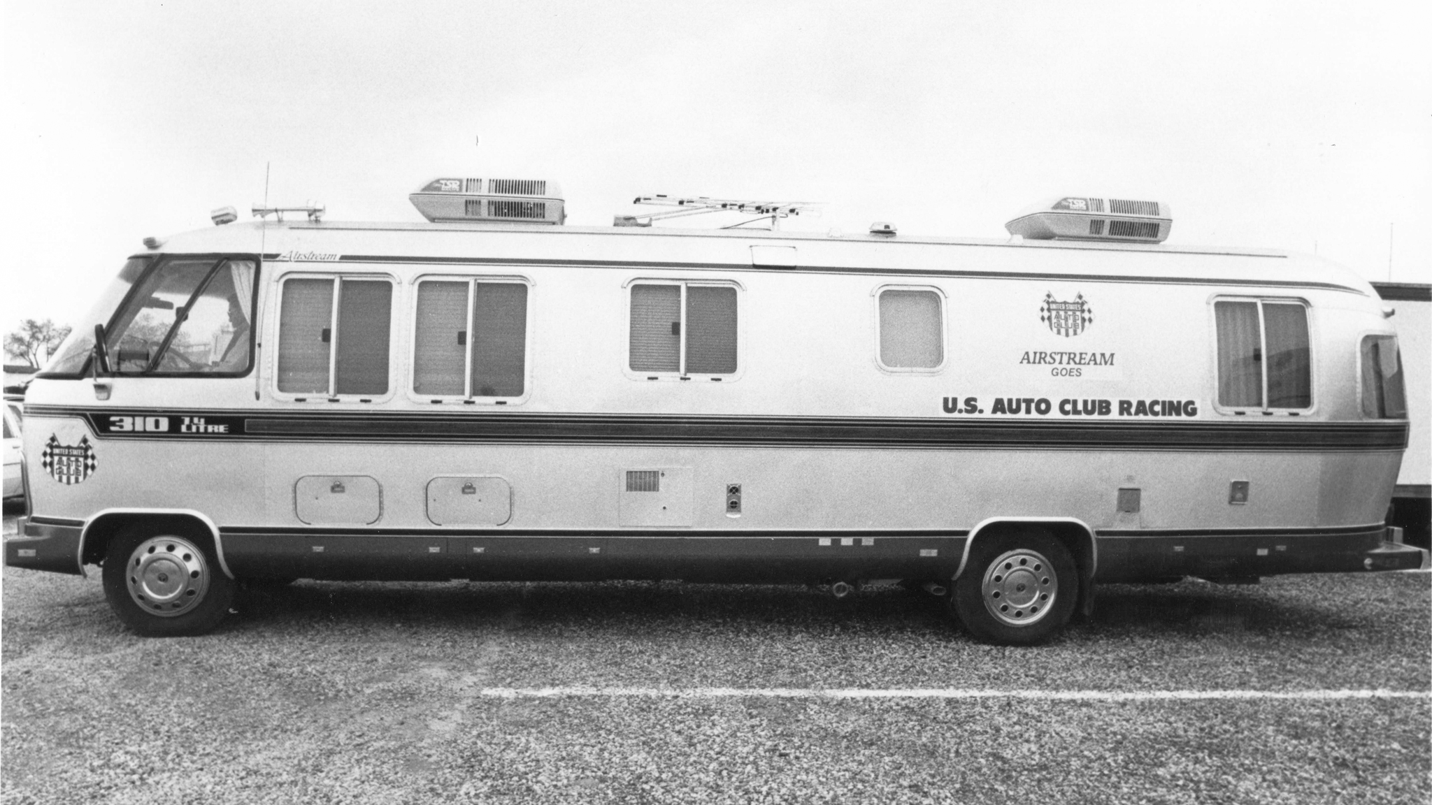 Airstream-Motorhome-Feature-Image|Airstream Astrovan II Boeing United States Capitol|AIRMKT-2022-Interstate-24X-Lifestyle-1432-WEB|Airstream Inc. headquarters in Jackson Center, Ohio after a rainy evening with a pink and purple sunset.|Airstream vintage A Van being built at Airstream|Vintage Airstream Funeral Coach sitting at a funeral home with flowers in the back and a coffin in the side of the Airstream.|A vintage Airstream Classic Class B Motorhome driving down the road with a white barn and farm in the background.|Airstream-Motorhome-Preview-Image