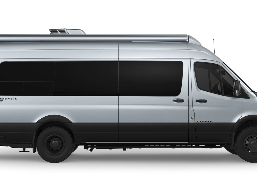 Silver Interstate 24GLX touring coach, side view.