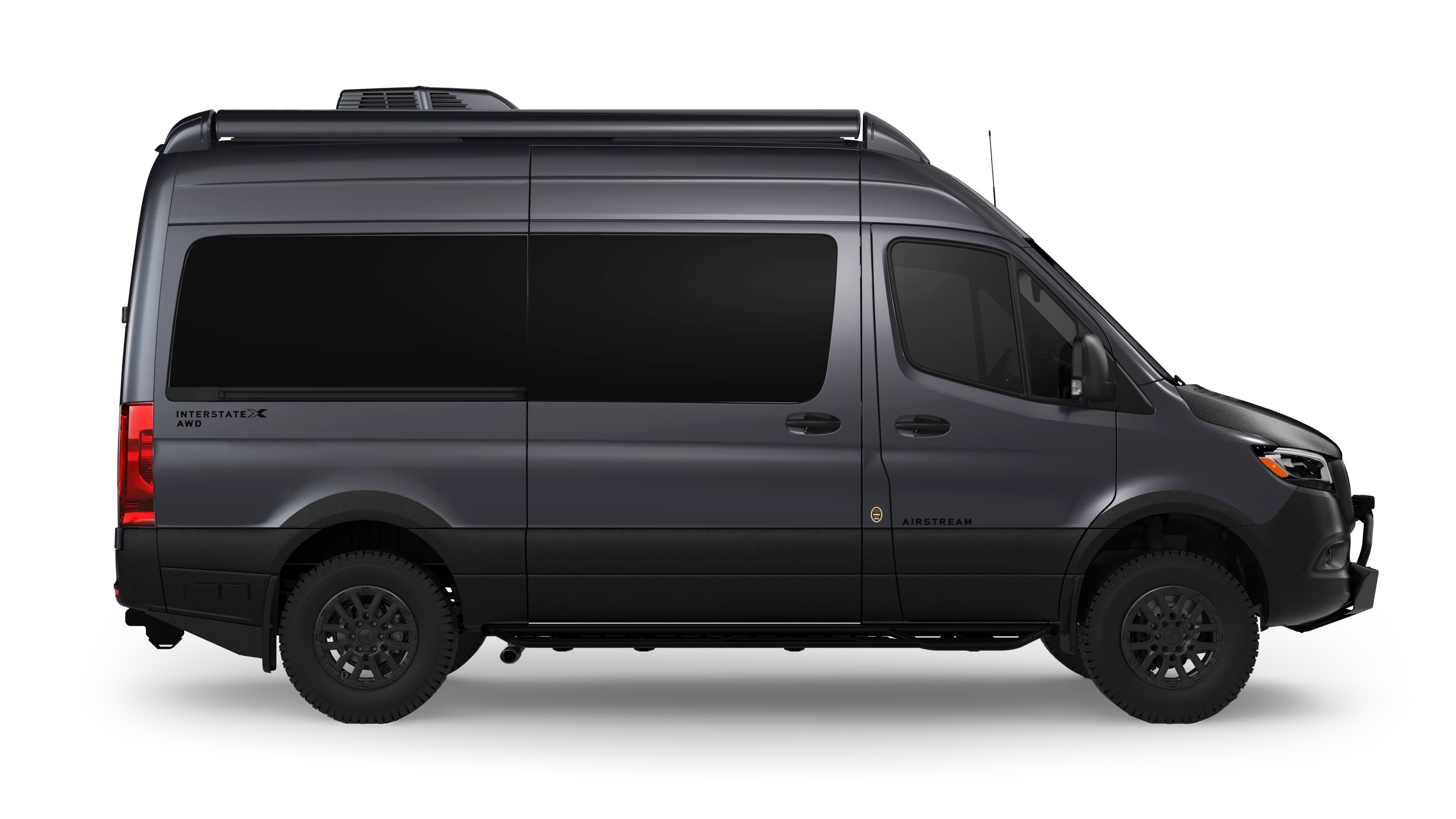 A sleek, dark gray Airstream Interstate X AWD camper van, shown from the side on a black background.