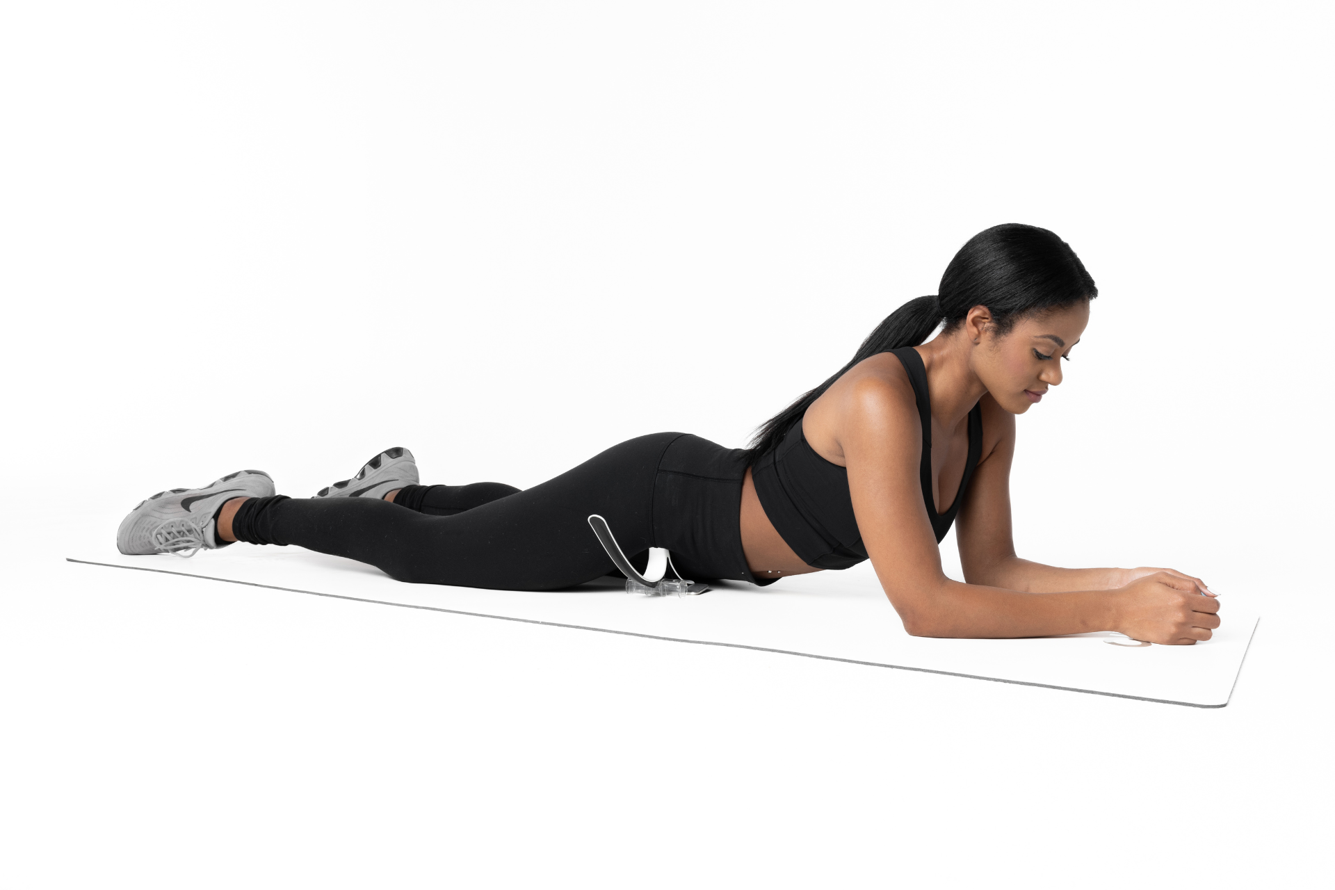 null woman using the Hip Hook hip flexor release tool