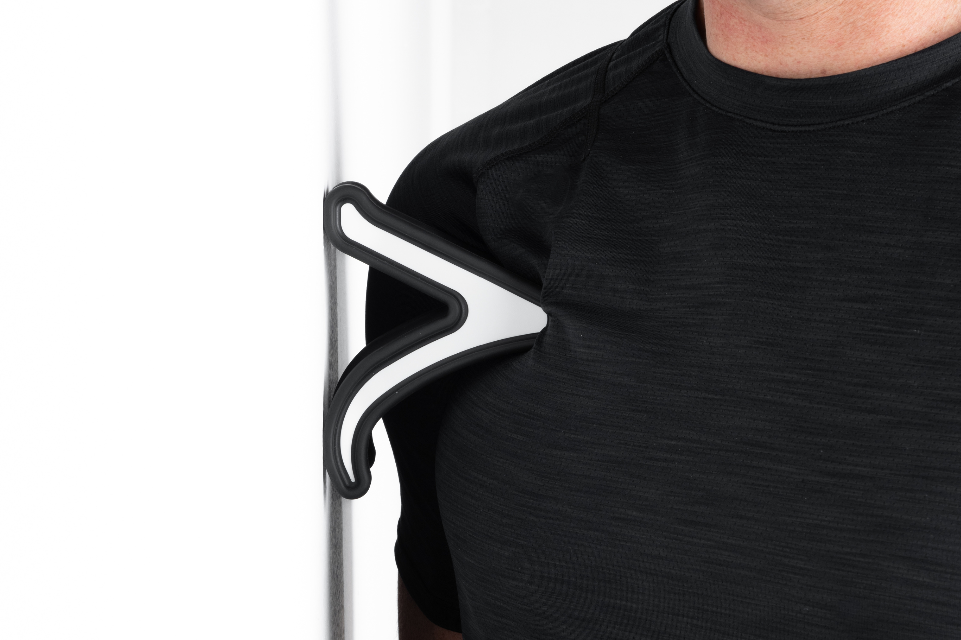 null man using Nuckle tool to relieve tight chest muscles