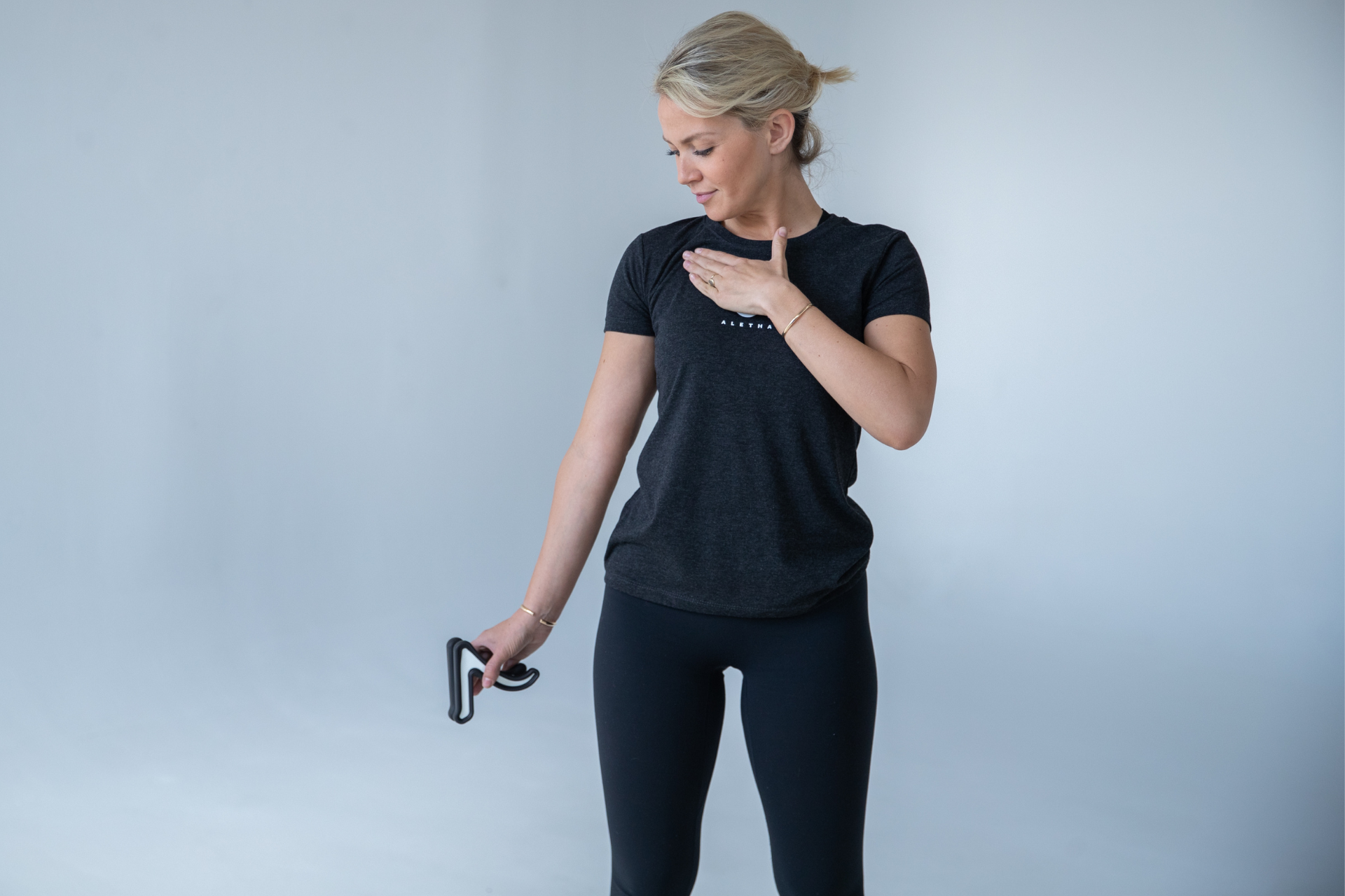 null woman pressing into pec minor muscle using her hand