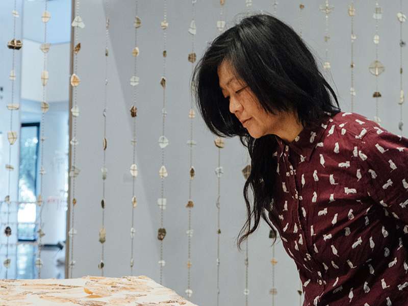 Patty Chang looks at an installation from her exhibit, “Patty Chang: surfacing.”