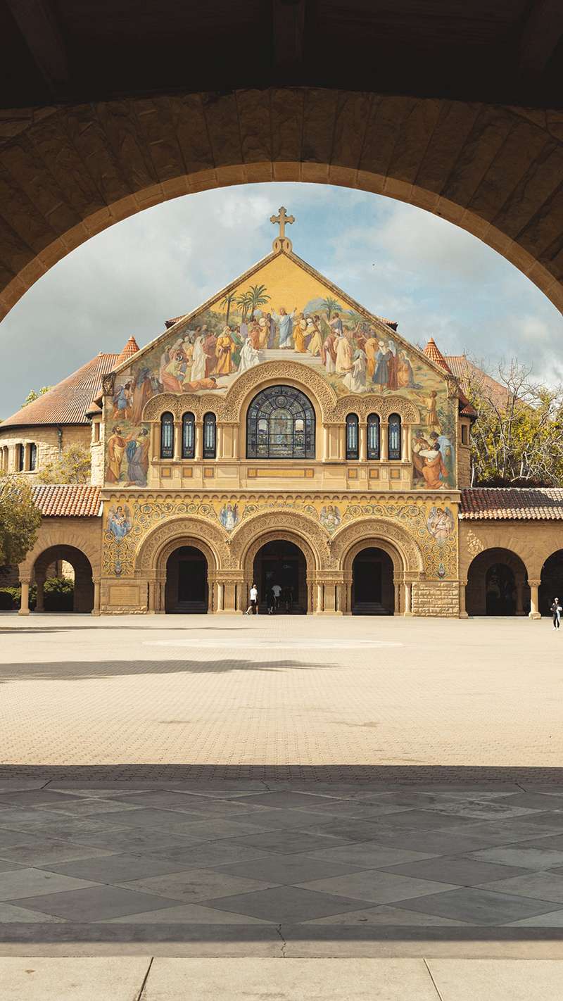 A view of Memorial Church through an archway.