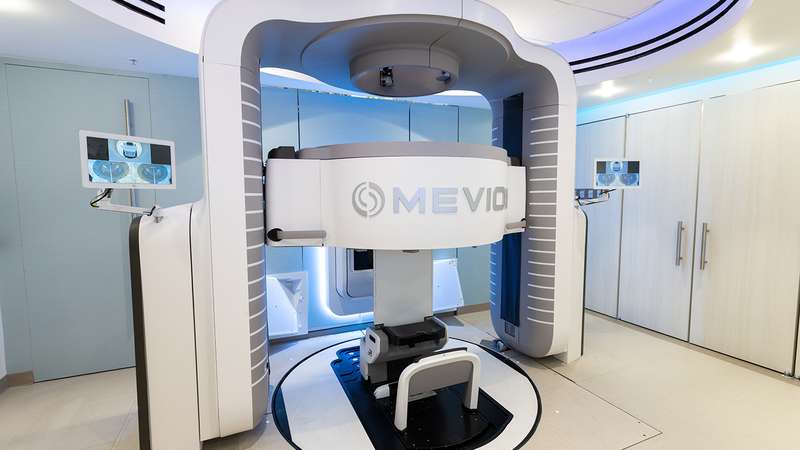 A modern medical imaging machine, designed for advanced diagnostic scans, featuring a central scanning area and sleek, futuristic design.