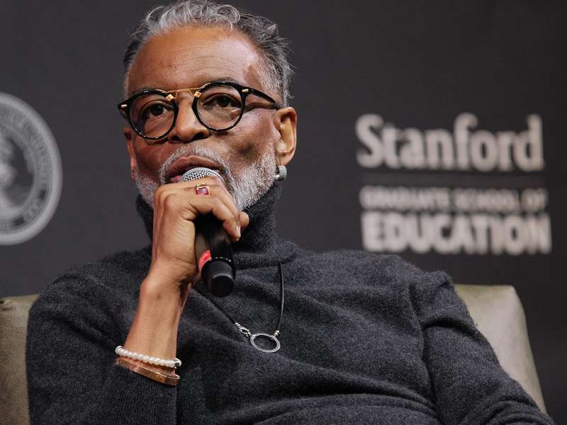 LeVar Burton speaks into a microphone during an event hosted by Stanford Graduate School of Education.