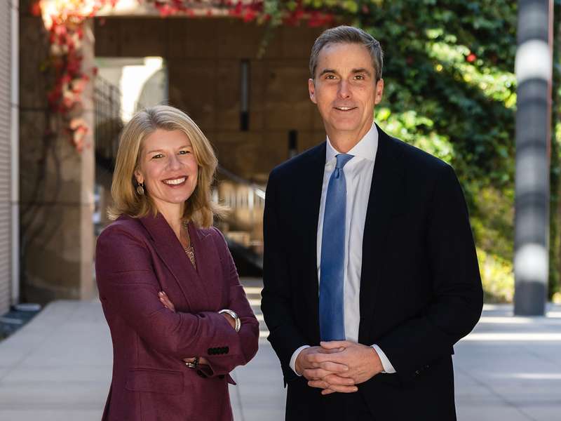 Image of Nora and David Freeman Engstrom standing together for a photo on the Stanford campus.