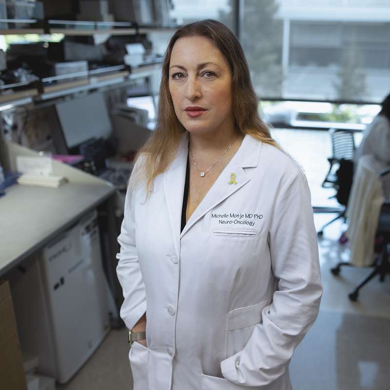 Profile photo of Michelle Monje posing for the photo in her lab.