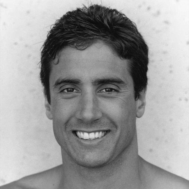 Pablo Morales smiling into the camera.