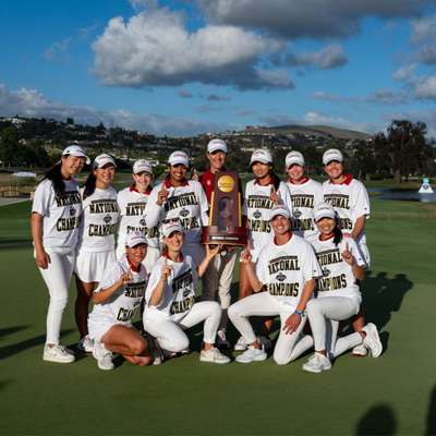 The women's golf team stands together after winning the NCAA championship