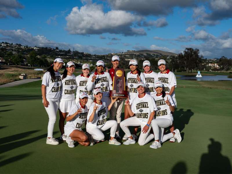 The women's golf team stands together after winning the NCAA championship