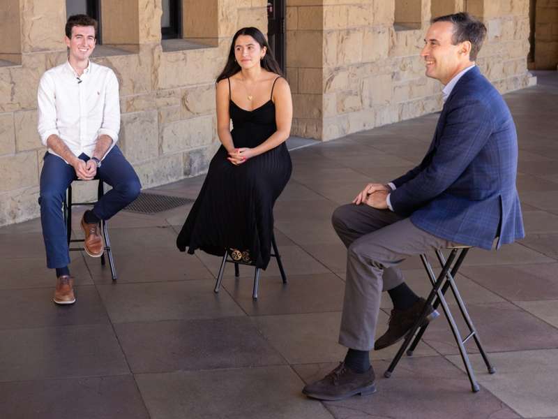 ASSU President Jared Hammerstrom, ’27, and Vice President Celeste Vargas, ’27, sitting down with Stanford President Jonathan Levin on campus