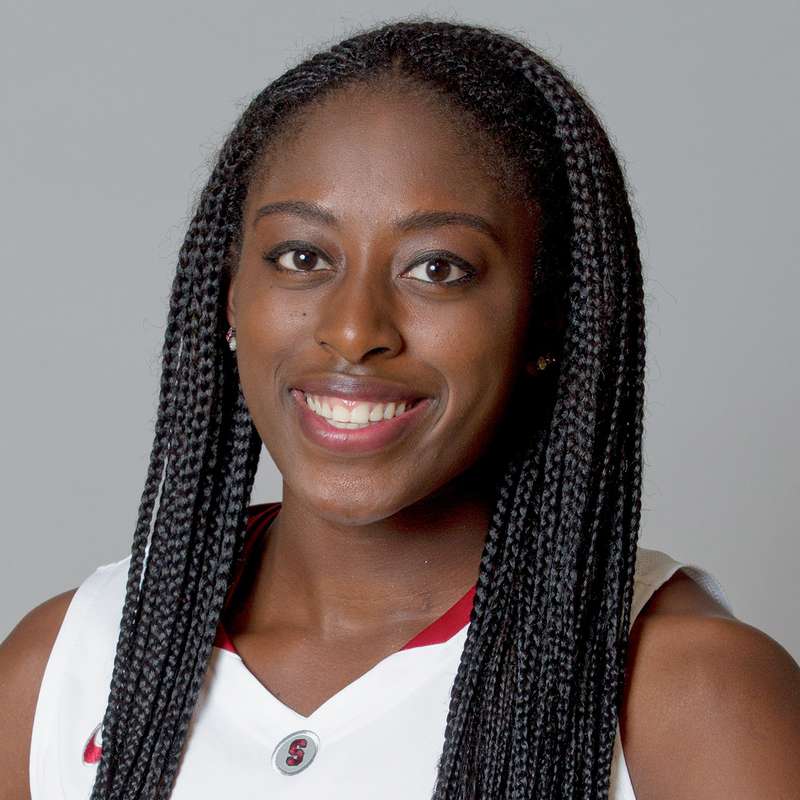 Chiney Ogwumike wearing a Cardinal basketball jersey and smiling at the camera for a profile photo against a neutral background.