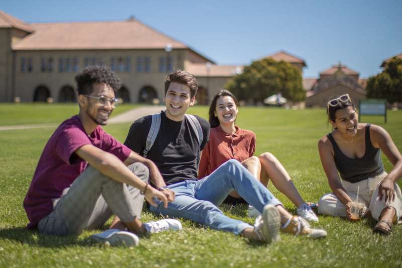 Students sitting in the grass