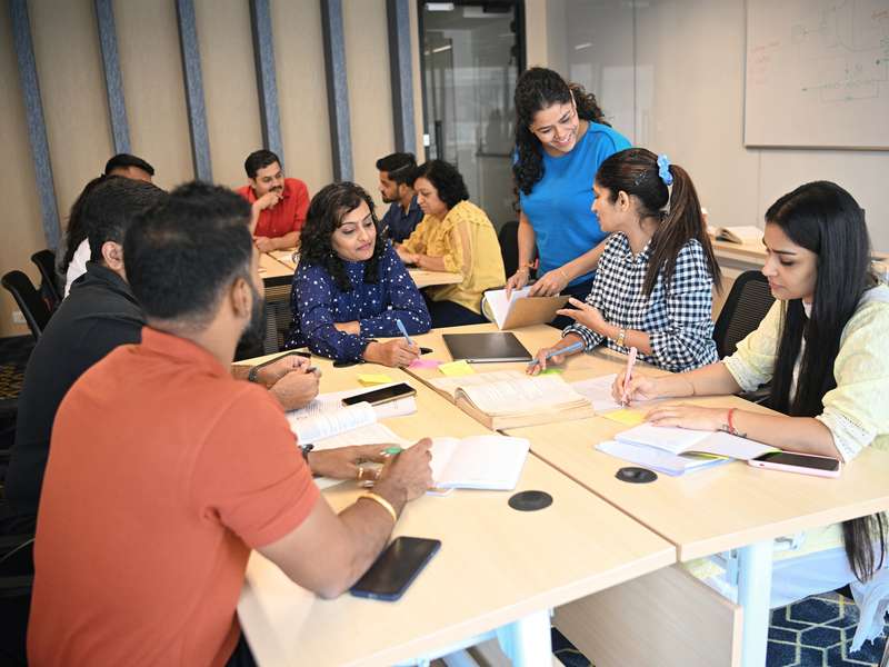 Class of students in India working together