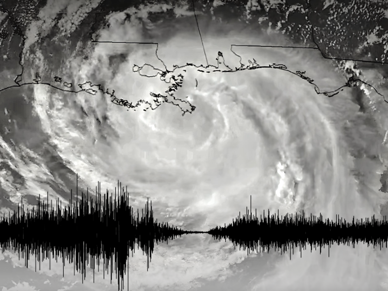 A satellite image of Hurricane Isaac in 2012 as it made landfall on the Louisiana coast, overlaid with a seismogram showing ground vibrations caused by strong winds before and after the calm eye of the storm passed