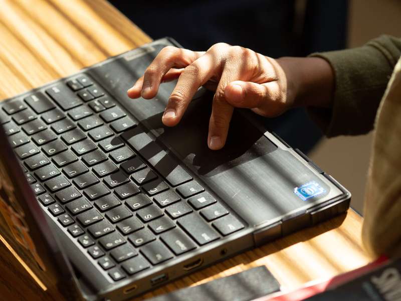 Close-up of hands on a laptop computer