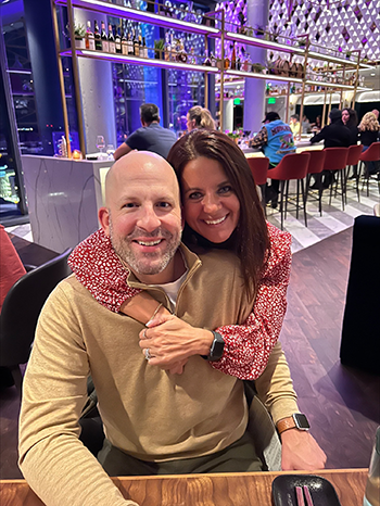 Photo of Andrea Siska and her husband in a restaurant