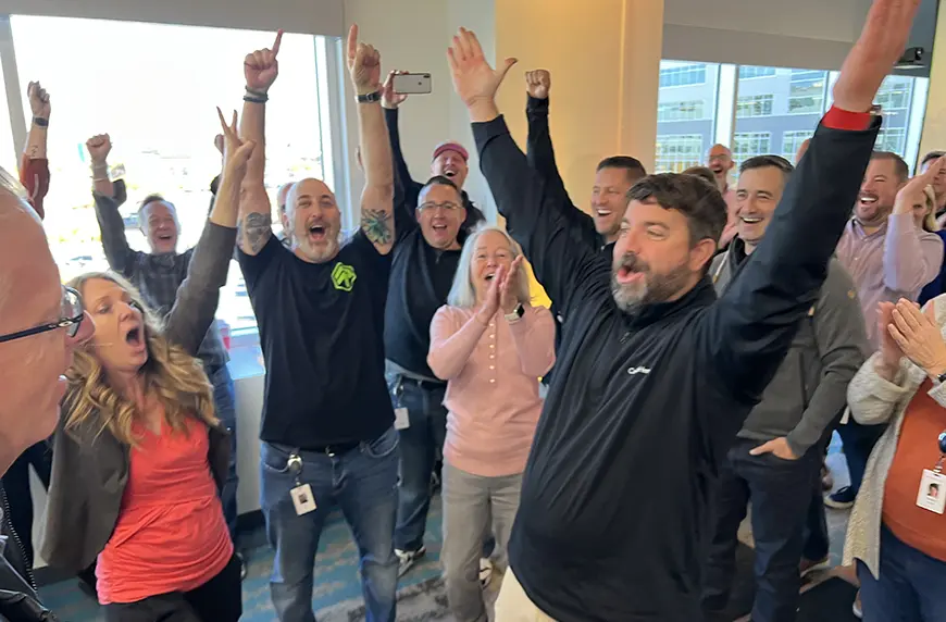 A group of CHG employees celebrating