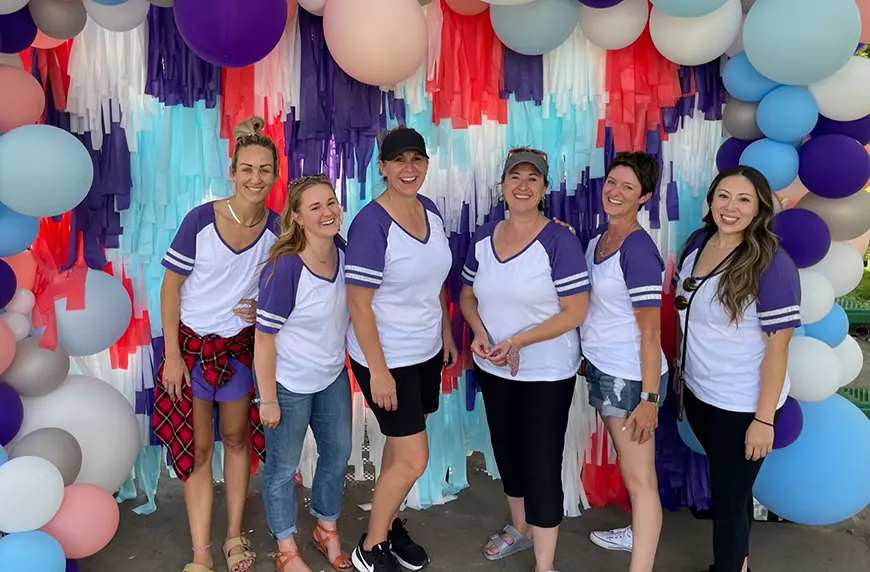 Group of CHG employees from CompHealth at an event