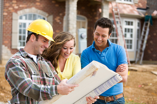 Homeowners discussing the construction on their home with a contractor