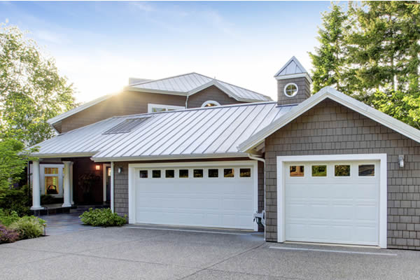 A house with a peaked metal roof