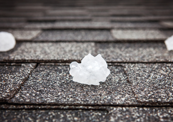 Chunks of hail damage to shingles