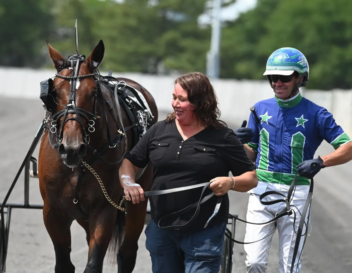 Sonja Booth and Sig Sauer (Photo courtesy Hambletonian Society Breeders Crown).JPG