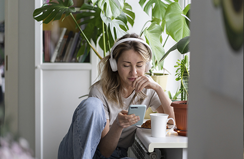 Woman on phone with headphones