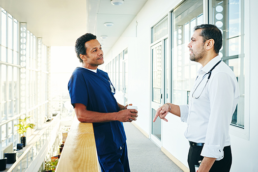 Healthcare professionals discussing in hospital