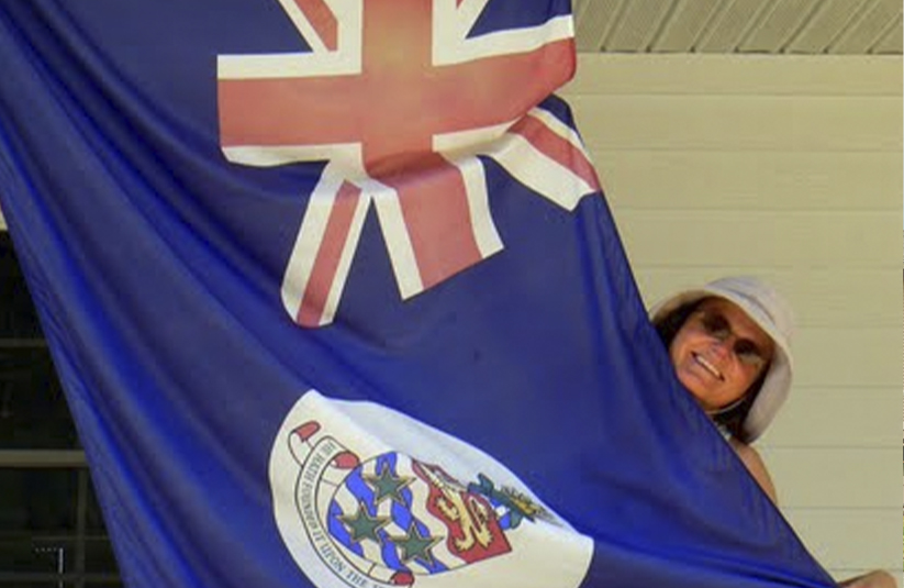 Dr. Starkey holding flag