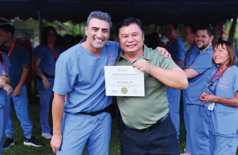 Dr Parsa with his translator on medical mission in Thailand