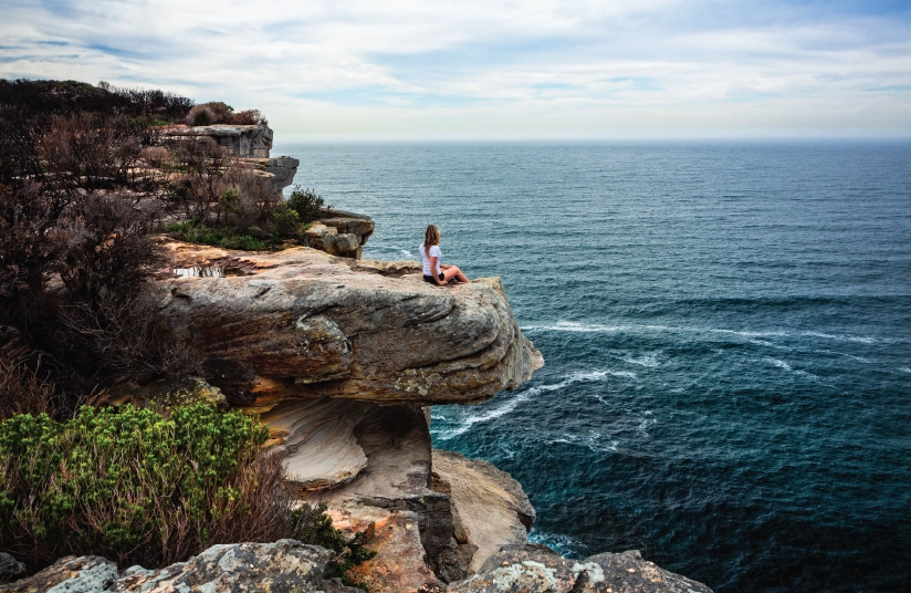picture of doctor overlooking the ocean in an international location