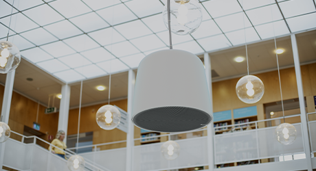 big speaker hanging from the ceiling