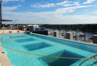 The outdoor pool at The Wharf's Channel apartment building, above The Anthem music venue