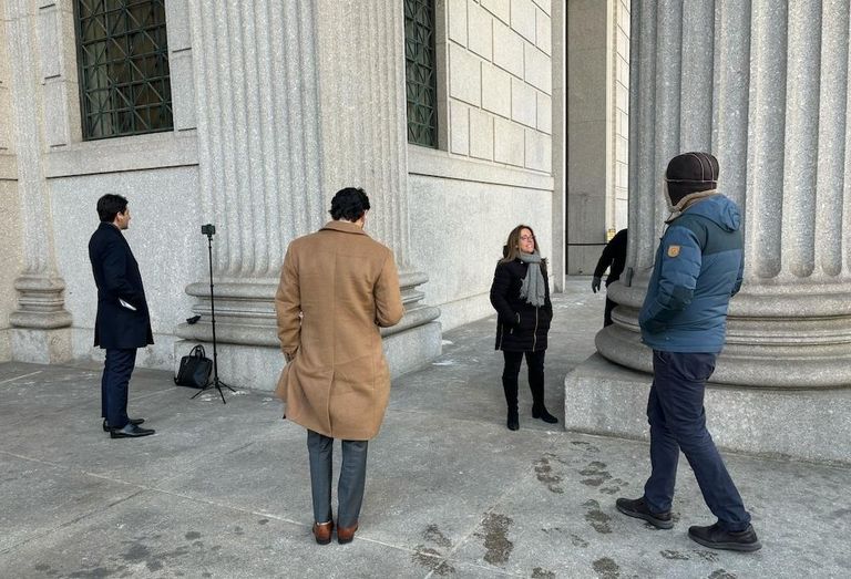 People gathered for the auction outside the New York State Supreme Courthouse, photographed minutes before the bidding began. 