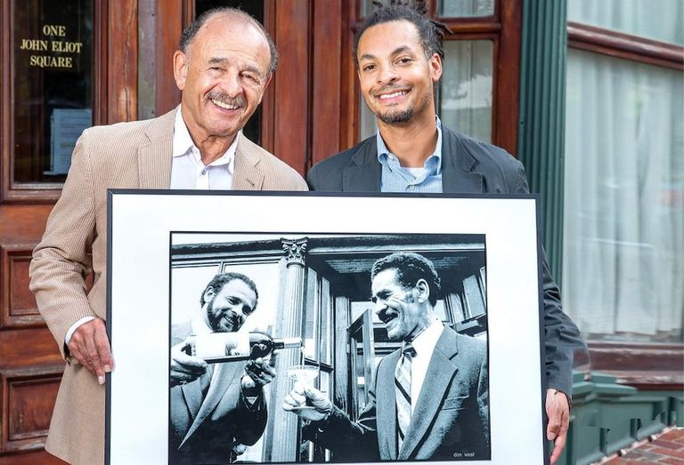 Cruz Cos.' John Cruz and his son, Justin Cruz, holding a framed photo of a younger John and his father who founded the company, John “Bertie” Cruz Jr.