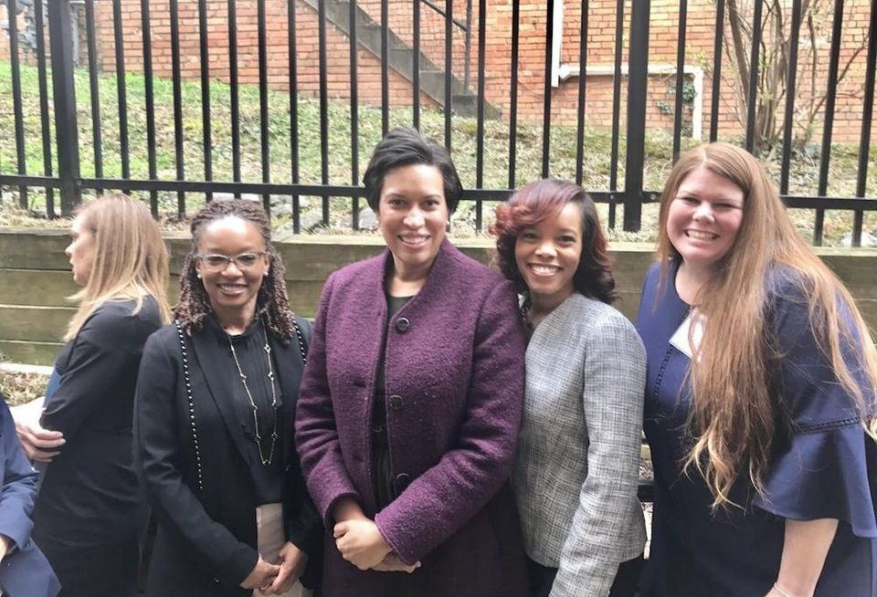 E&G Group CEO's Melissa Steele (right) with Mayor Muriel Bowser (second from left) at the Meadow Green Courts property in 2018.