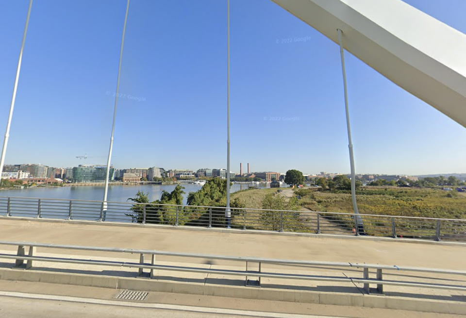 A view from the Frederick Douglass Memorial Bridge, with the booming Navy Yard neighborhood on the left side of the river and the undeveloped Poplar Point area on the east. 