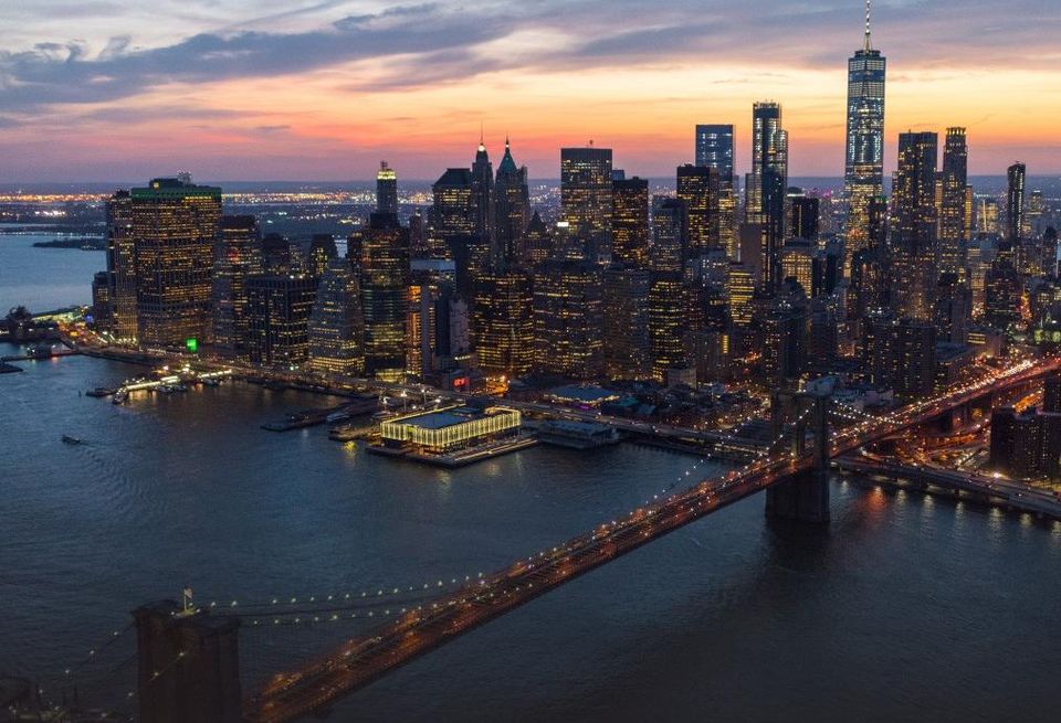 Aerial image of the Seaport District in Lower Manhattan, with the Brooklyn Bridge in the foreground