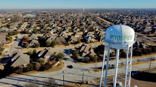 aerial view of water tower and homes