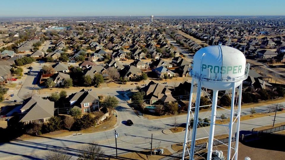 aerial view of water tower and homes